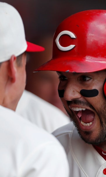Suarez homers early, Reds hold on for 8-6 win over Cubs
